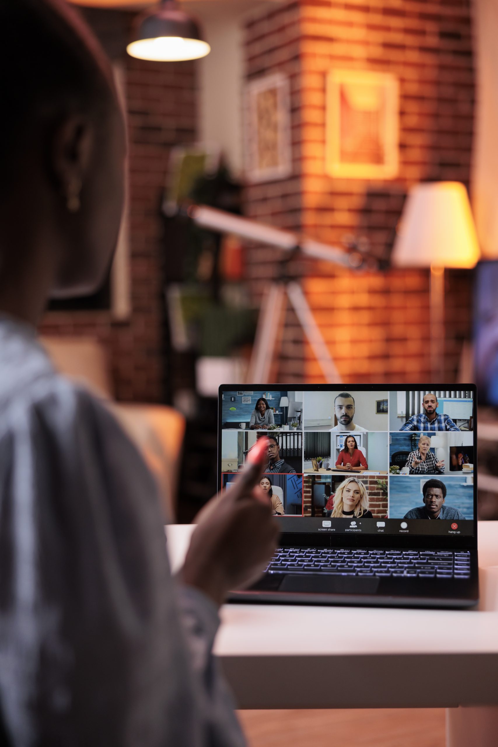 businesswoman-chatting-with-remote-team-teleconference-using-laptop-back-view-company-colleagues-discussing-business-videocall-office-employees-teamwork-cooperation-scaled-1